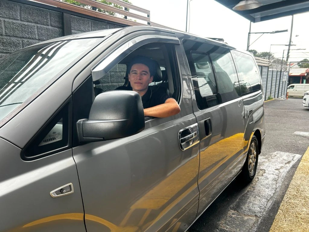 The minibus that shuttles customers between SJO airport and the office